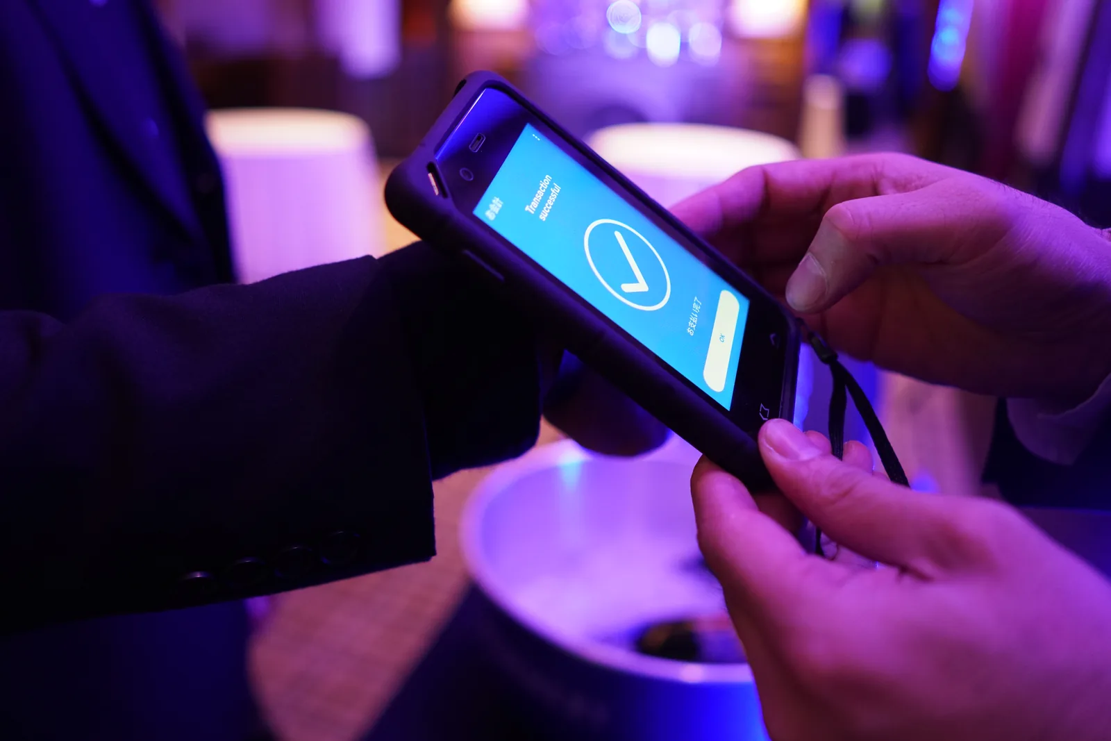 Close-up of the handheld screen showing a Transaction successful confirmation after a payment.